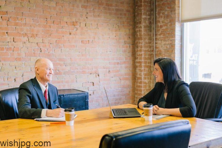 The Benefits of Using Relationship Mapping Software in Business Networking Two professionals in an office conference room discussing relationship mapping software to enhance connectivity and understanding